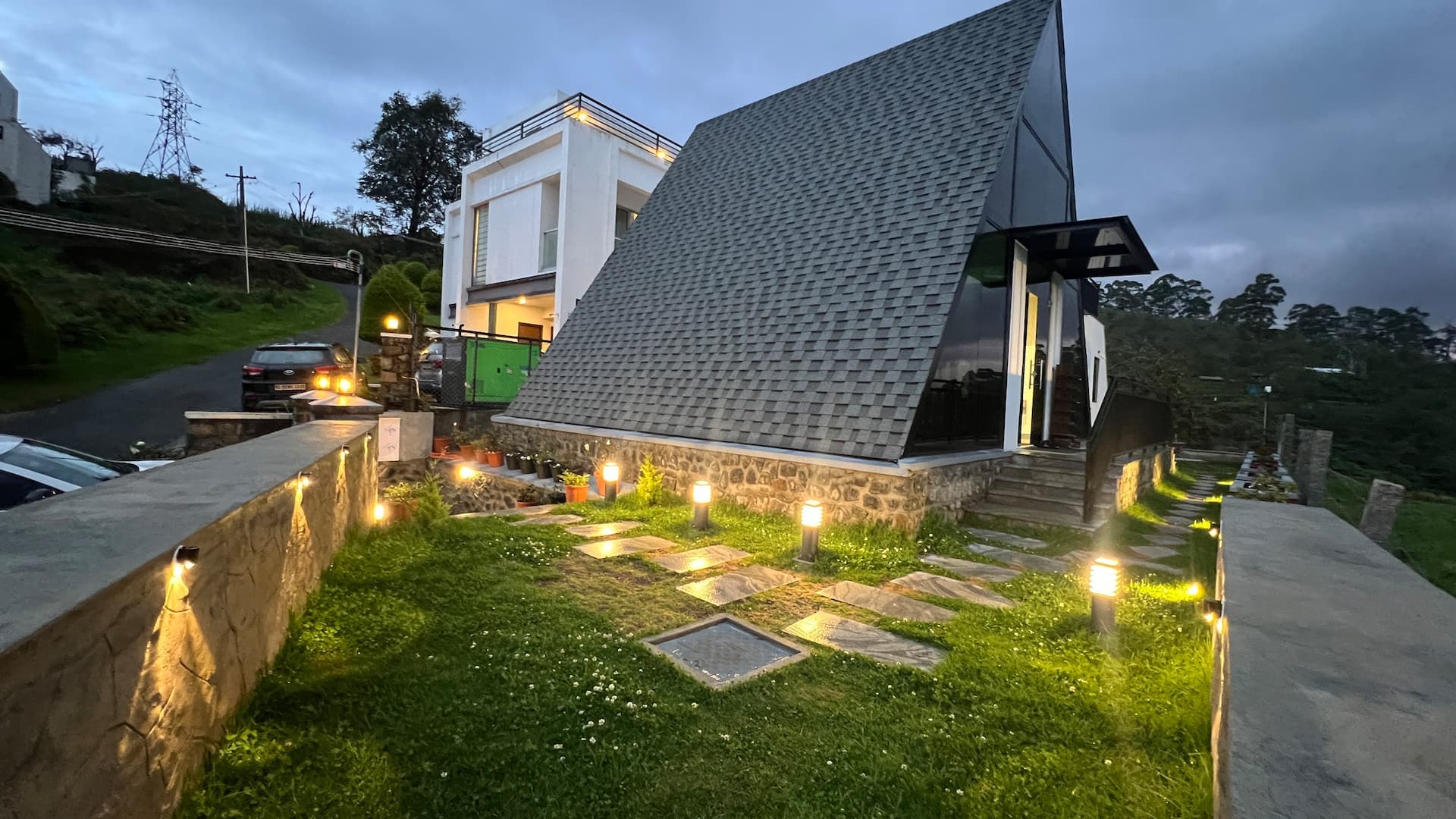 Villa garden lit at dusk