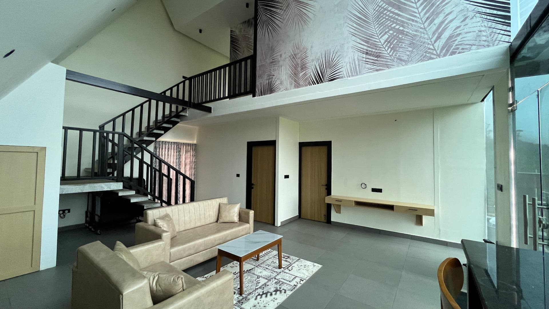 Double-height living space and staircase