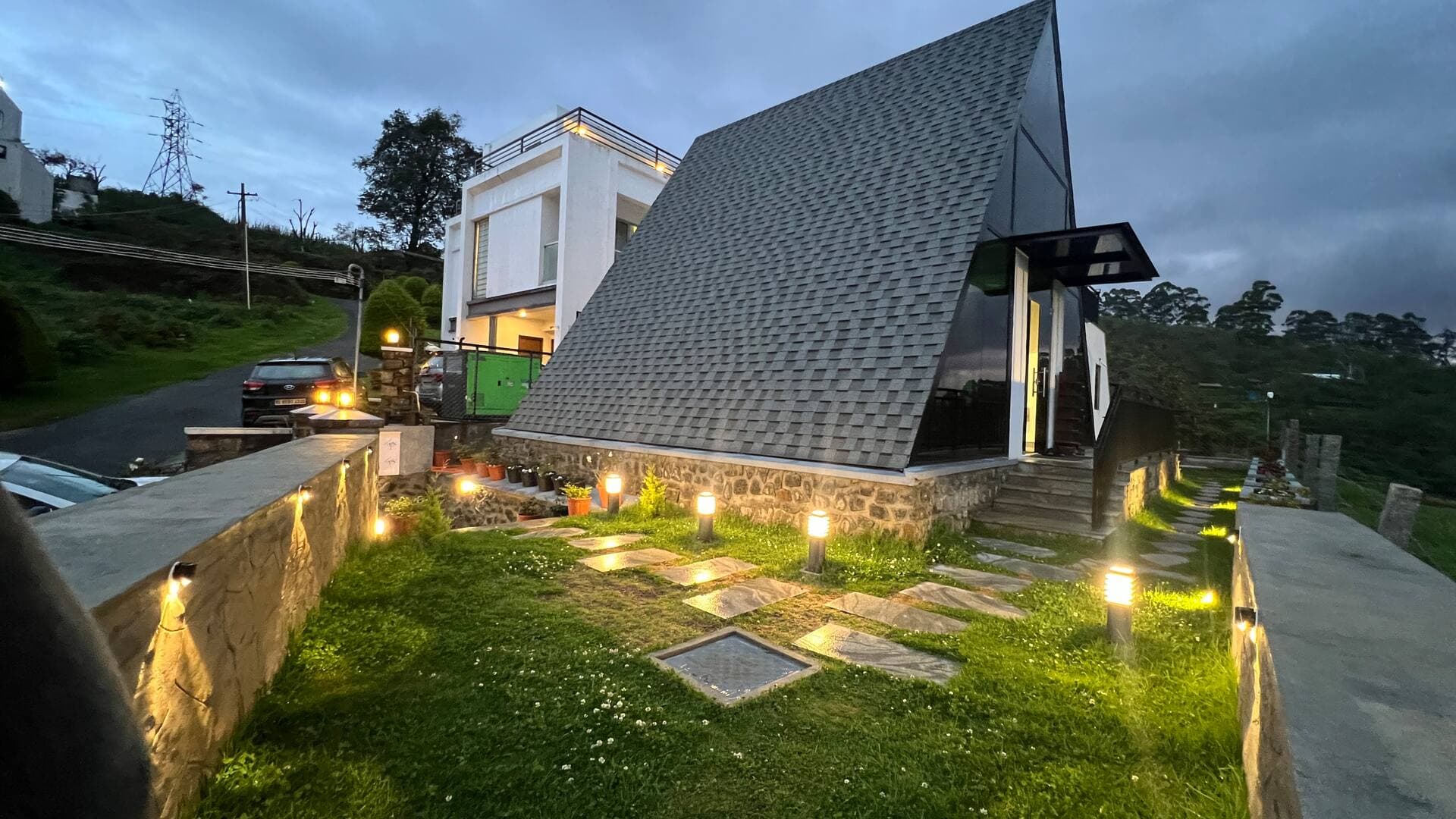 Lit stone path to the villa